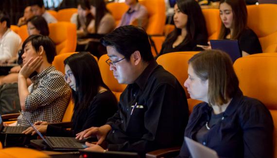 A group of people in the audience of an open access conference.