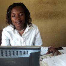 A nurse practising her computer skills in the library.