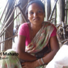 A vegetable farmer in her house.